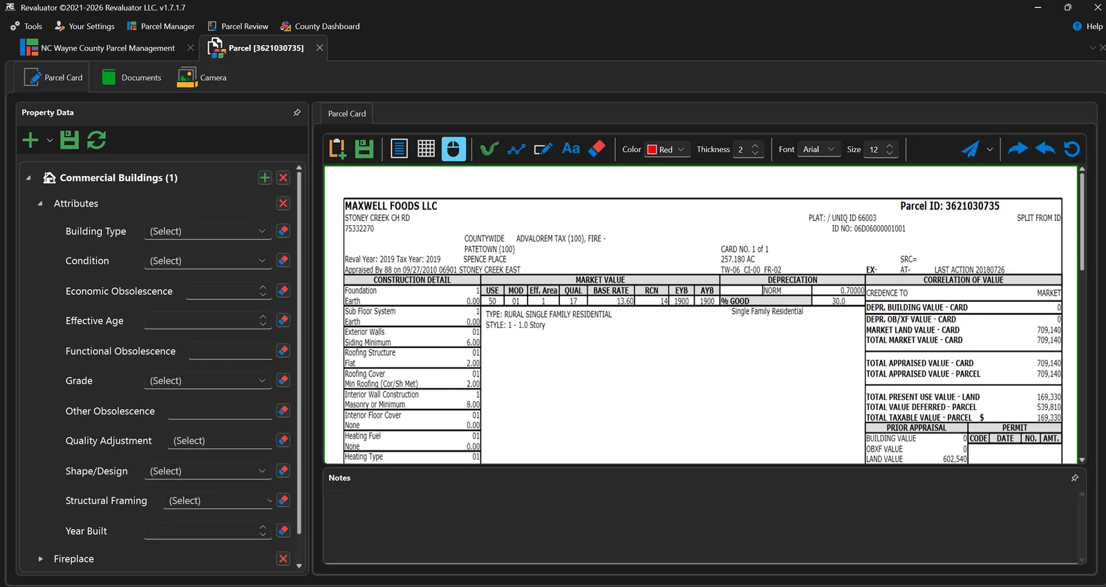 Parcel detail screen with a commercial building attribute editor on the left and a scanned parcel card open for markup on the right.